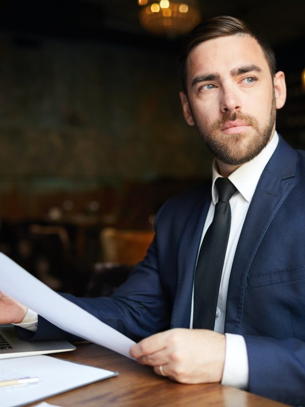 Successful business consultant with papers
